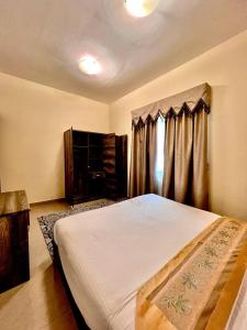 Postel nebo postele na pokoji v ubytování Dream Palace Hotel