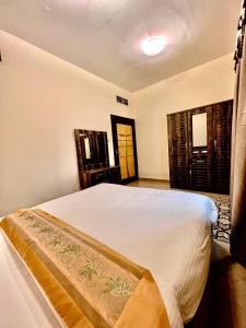 Postel nebo postele na pokoji v ubytování Dream Palace Hotel