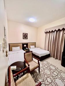Postel nebo postele na pokoji v ubytování Dream Palace Hotel