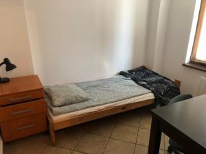 Postel nebo postele na pokoji v ubytování Kwatery Mamma Mia Opawska 1a