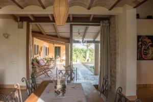 an open dining room with a table and chairs at Petit Torrent Fals in Santa Eugenia