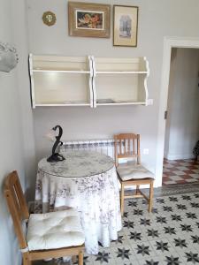 a room with a table and two chairs at EN EL CORAZÓN DE HUESCA in Huesca