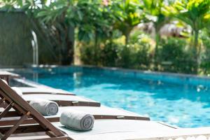 Басейн в CHiEM HoiAn - The Beachside Boutique Hotel & Villa або поблизу