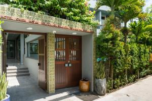 Сад в CHiEM HoiAn - The Beachside Boutique Hotel & Villa