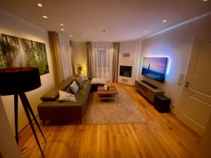 TV a/nebo společenská místnost v ubytování Haus-Holiday-Ferienhaus-in-Bad-Sachsa