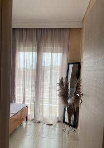 Postel nebo postele na pokoji v ubytování Helenas Apartment