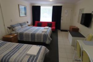 Letto o letti in una camera di Emu Point Motel
