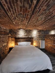 Postel nebo postele na pokoji v ubytování Luxury Spa Hotel - Francofolies