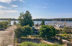 a view of a marina with boats in the water at Cozy Home In Blankaholm With Wifi in Blankaholm
