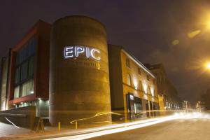 a building with a sign on the side of it at night at Seel Street Apartments by EPIC in Liverpool