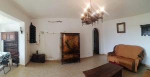 a living room with a couch and a table at Le repaire des pirates in Pietrosella