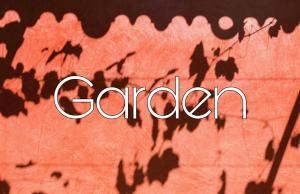 a sign that says garden with the shadows of leaves at Case di Sotto, House & Breakfast in Locarno