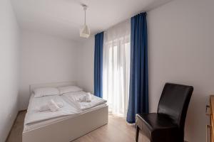 Posteľ alebo postele v izbe v ubytovaní Horyzont Apartamenty - Kapitański Mostek- BLISKO PORTU- Śniadania