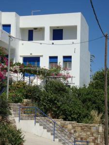 a white building with stairs in front of it at Emilianos Studio in Chios