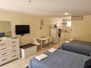 Letto o letti in una camera di Emu Point Motel