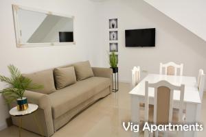 a living room with a couch and a table at Vig Apartments in Timişoara
