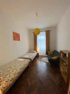a living room with two beds and a couch at Apartman Anđela Pula Centar in Pula