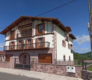 a house with balconies on the side of it at Landazelaia in Garzáin