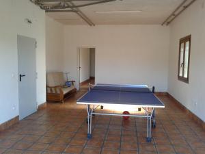 an empty room with a ping pong table in it at Landazelaia in Garzáin