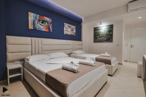 Postel nebo postele na pokoji v ubytování Hotel Alpha