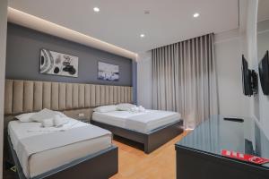 Postel nebo postele na pokoji v ubytování Hotel Alpha