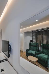 TV a/nebo společenská místnost v ubytování Hotel Alpha