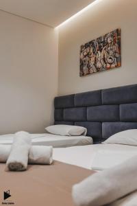 Postel nebo postele na pokoji v ubytování Hotel Alpha