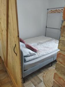 a bedroom with a bed in a room at Na początku in Budzów