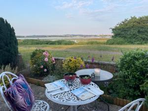 a table and two chairs sitting on a patio at Waterfront - Holes Bay, Poole, Dorset in Hamworthy