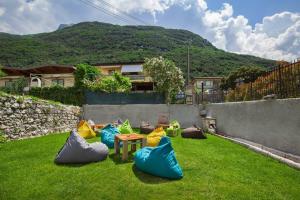 a garden with a bunch of bags on the grass at Il Frantoio a Lago in Malcesine