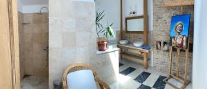 a bathroom with a sink and a toilet in a room at Rustic room 2 next to beach in Constanţa