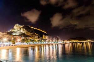 a view of a beach at night at Casa Ojala in Alicante