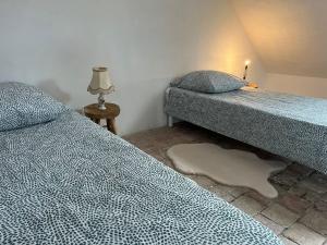 Tempat tidur dalam kamar di la maison Haute