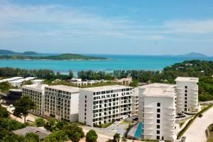 an aerial view of a building with the ocean in the background at Wyndham La Vita Rawai Phuket in Rawai Beach