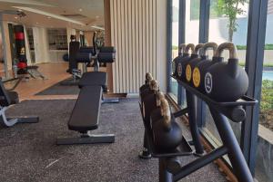 a gym with lots of cardio equipment in a building at Wyndham La Vita Rawai Phuket in Rawai Beach