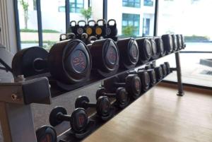 a row of black dumbbells in a gym at Wyndham La Vita Rawai Phuket in Rawai Beach