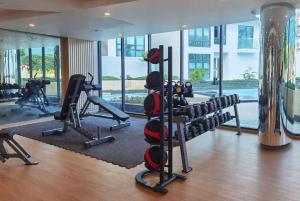 a gym with treadmills and machines in a building at Wyndham La Vita Rawai Phuket in Rawai Beach