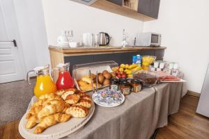 a table with bread and other foods on it at Hotel Arami by Downtown in Yerevan