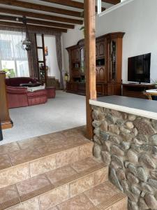 a large living room with a stone wall at Mecklenburg Vorpommern in Neukalen