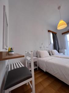 Postel nebo postele na pokoji v ubytování Sifnos Valley