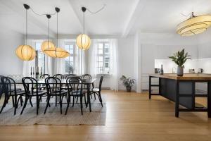 a dining room with a table and chairs at Boutique apartment in Citycenter in Copenhagen