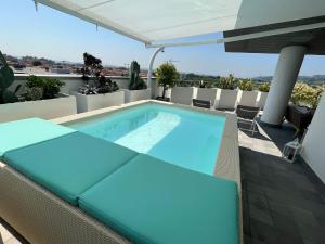 a swimming pool on the roof of a house at La Furibonda in Fano