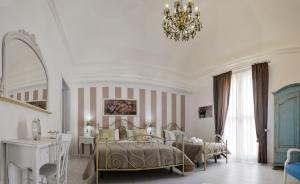 Postel nebo postele na pokoji v ubytování TAM Vacanze B&B