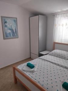 Postel nebo postele na pokoji v ubytování Apartments Leon