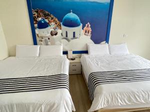 Een bed of bedden in een kamer bij Meet ‧ Happiness B&B