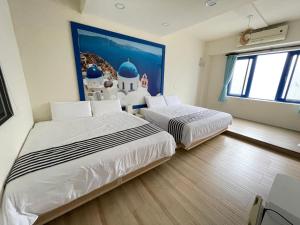 Een bed of bedden in een kamer bij Meet ‧ Happiness B&B