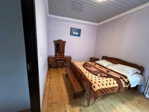 Postel nebo postele na pokoji v ubytování Jachvliani Guest House
