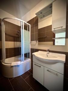 a bathroom with a sink and a shower at Apartments Mestrovic, Klimno, Soline bay, island Krk in Klimno