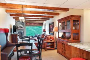 a living room with a dining table and chairs at Sheraton Steamboat Resort Villas in Steamboat Springs