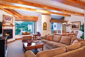 a living room with a couch and a fireplace at Sheraton Steamboat Resort Villas in Steamboat Springs